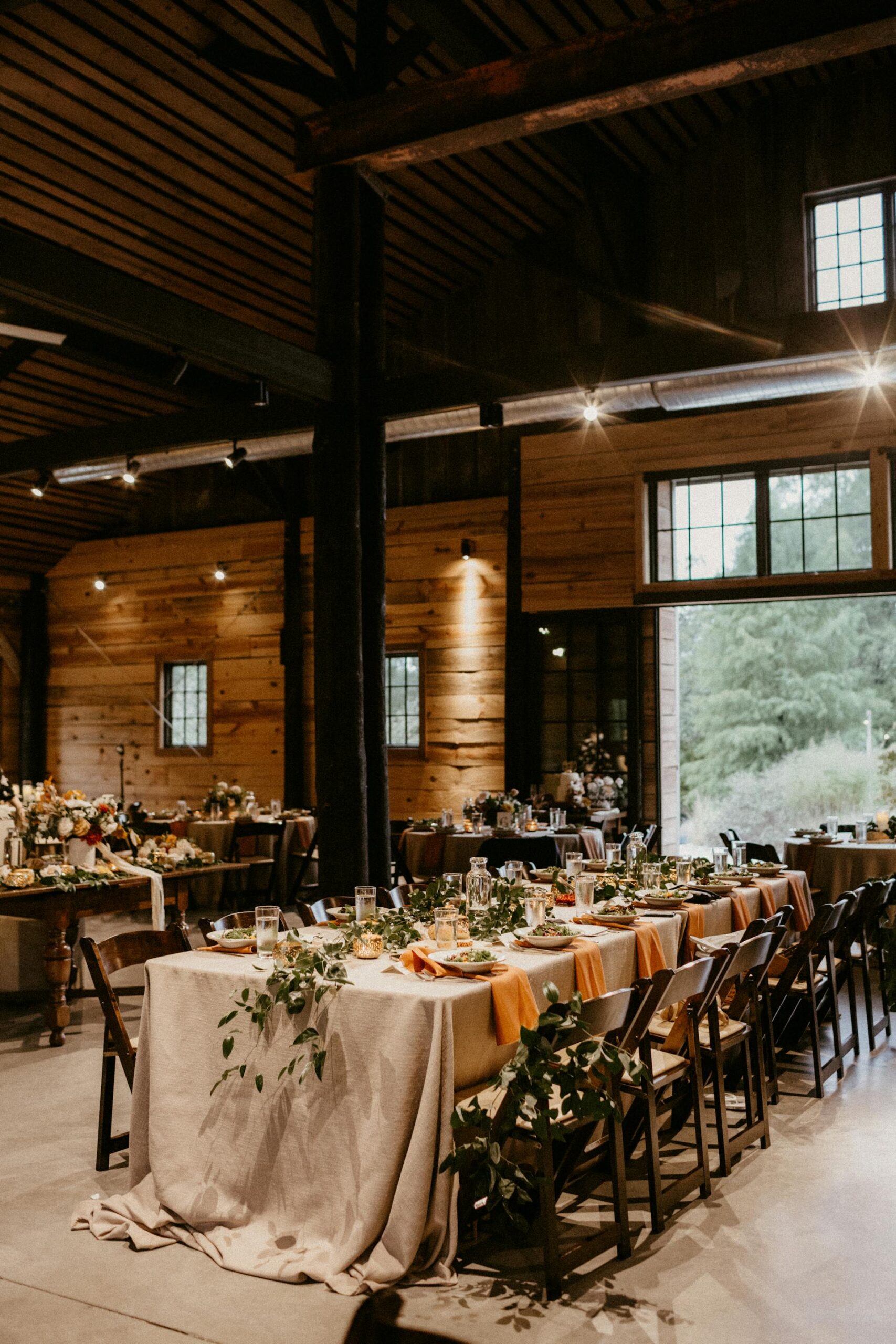 A sophisticated function venue with a black-and-white theme and modern lighting.