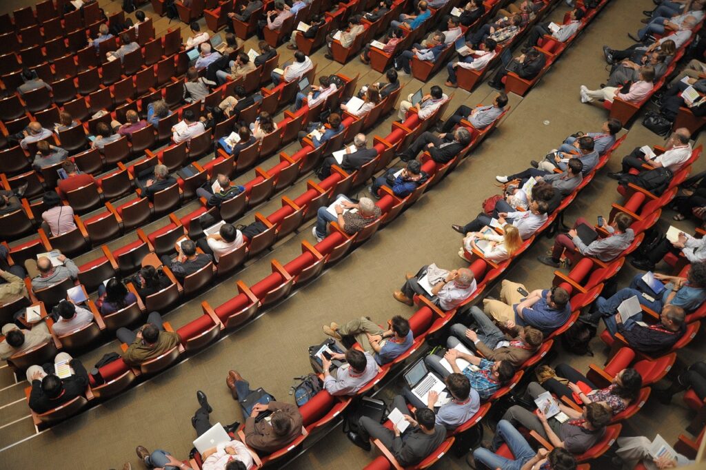 A lecture hall filled with attendees, ideal for corporate conferences, seminars, and business events.