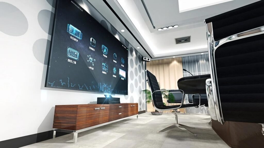 A professional meeting room featuring a large screen, designed for corporate presentations, training sessions, and business meetings.